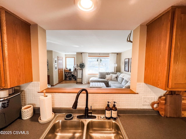 kitchen featuring sink and decorative backsplash