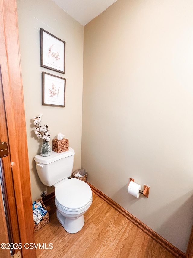 bathroom featuring toilet and hardwood / wood-style floors