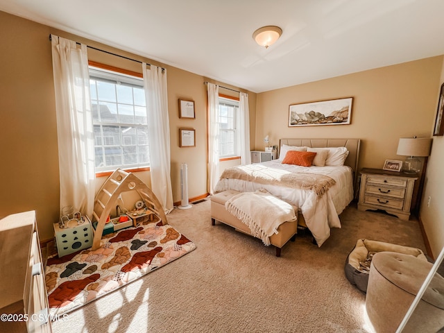 bedroom featuring light carpet