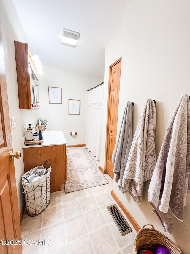 bathroom featuring vanity and walk in shower