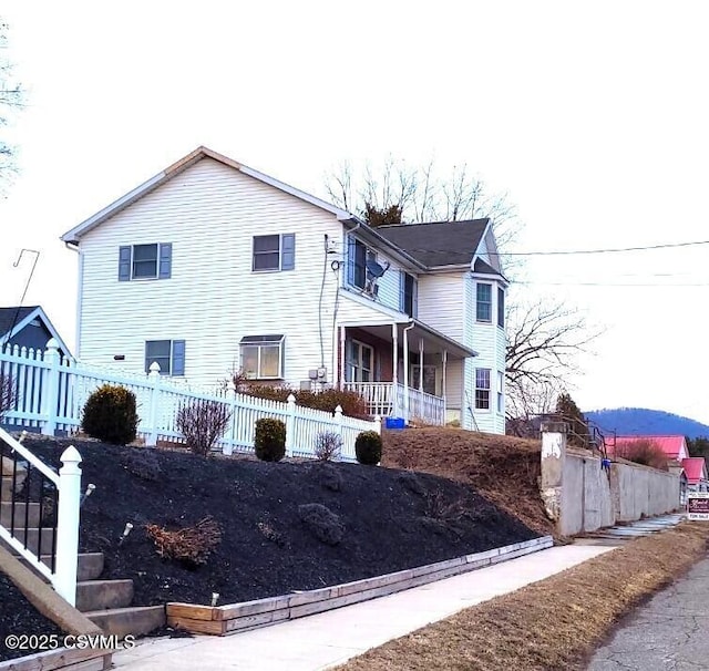 view of front of home with fence