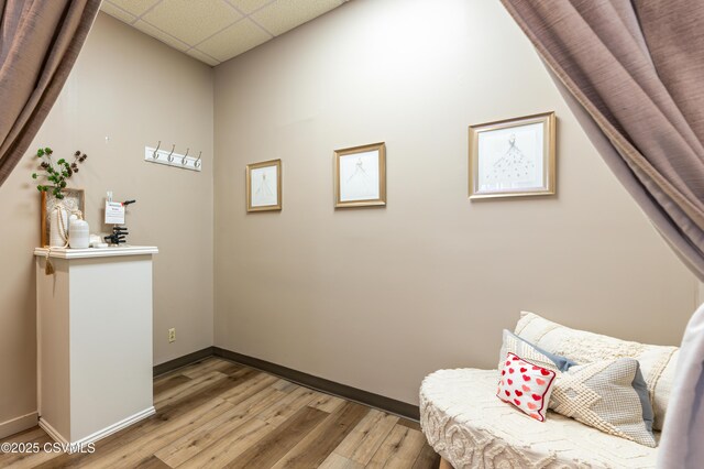 53 W Main St, Bloomsburg, PA 17815 - living area with a paneled ceiling and light hardwood / wood-style flooring