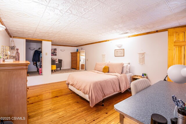 53 W Main St, Bloomsburg, PA 17815 - bedroom with wood-type flooring and ornamental molding