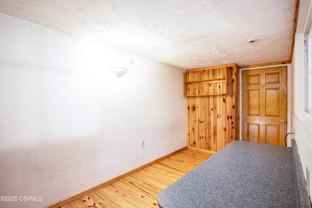 53 W Main St, Bloomsburg, PA 17815 - bedroom featuring hardwood / wood-style flooring and a textured ceiling
