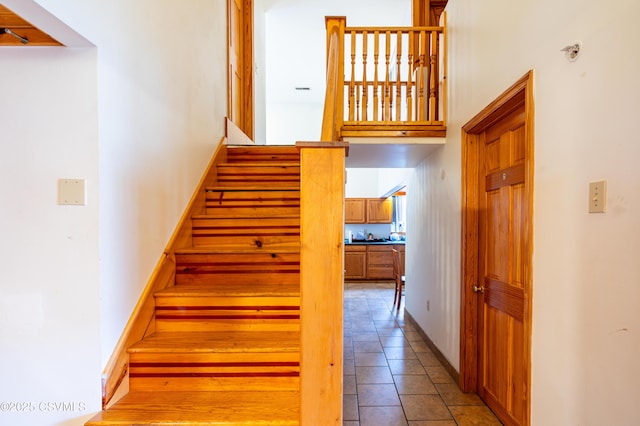 53 W Main St, Bloomsburg, PA 17815 - stairs with a high ceiling and tile patterned flooring