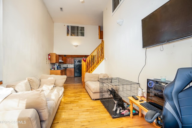 53 W Main St, Bloomsburg, PA 17815 - living room featuring light hardwood / wood-style floors and a high ceiling