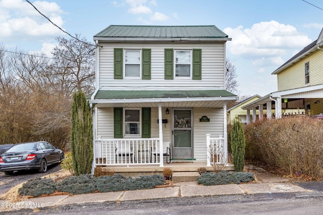 view of front property featuring covered porch