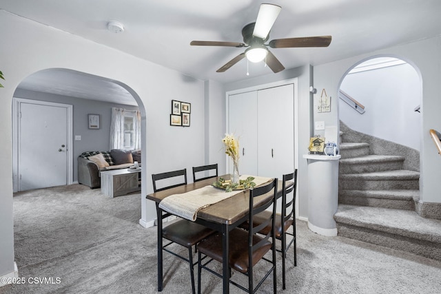 dining room with carpet and ceiling fan