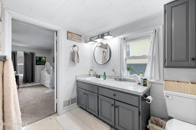 bathroom with vanity and toilet