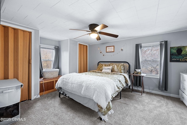 bedroom with light carpet and ceiling fan