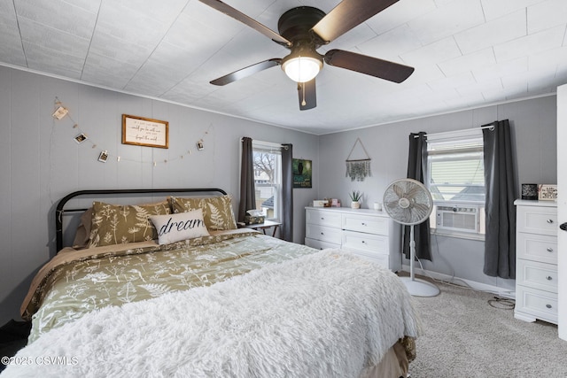 bedroom with cooling unit, ceiling fan, and light carpet