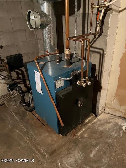 utility room featuring a heating unit
