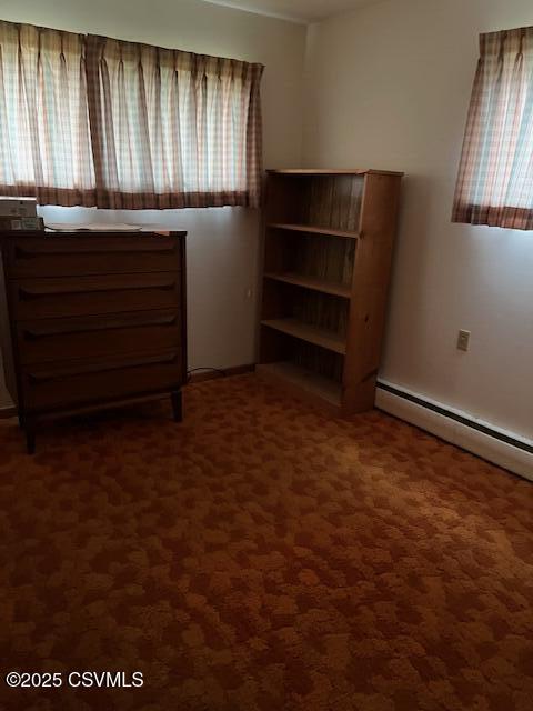 unfurnished bedroom with dark carpet