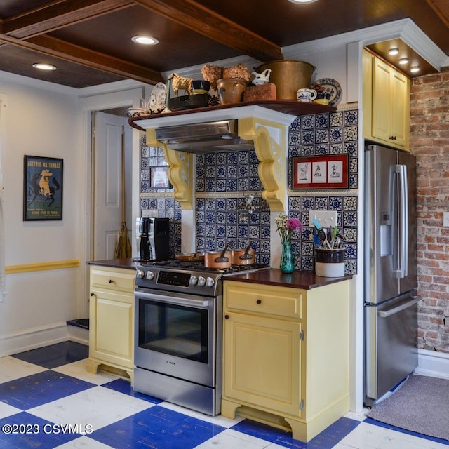 kitchen featuring stainless steel appliances, beam ceiling, range hood, and decorative backsplash