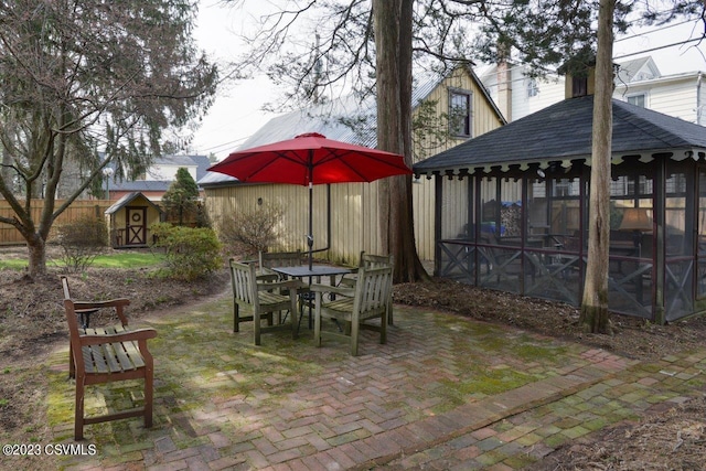 view of patio with a shed