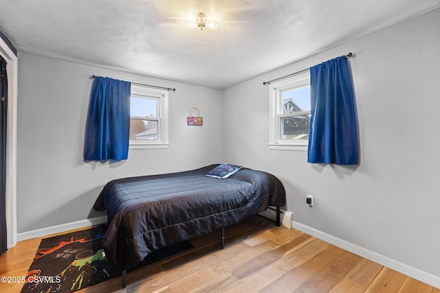 bedroom with wood-type flooring