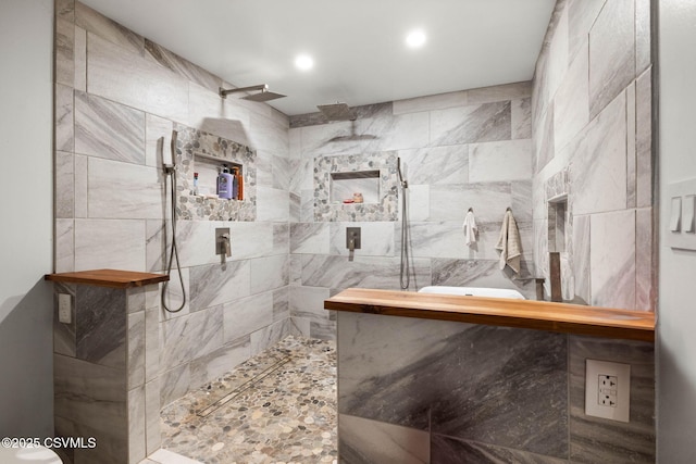 bathroom featuring a tile shower