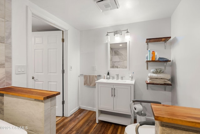 bathroom featuring vanity and hardwood / wood-style flooring