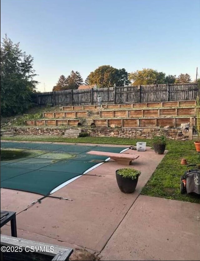 view of swimming pool featuring a patio