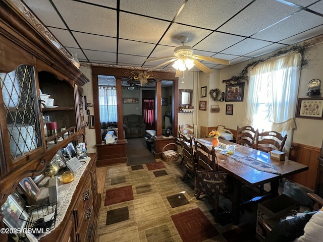 dining area featuring a wealth of natural light, a paneled ceiling, and ceiling fan