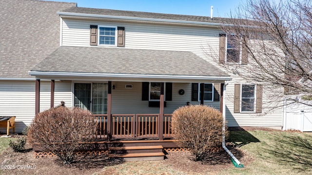 view of front facade featuring roof with shingles