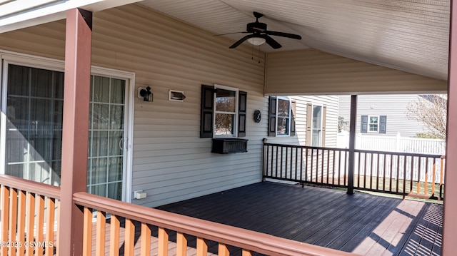 wooden terrace featuring a ceiling fan and fence