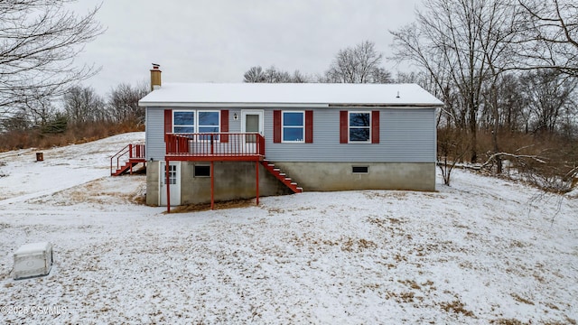 view of front of property featuring a wooden deck