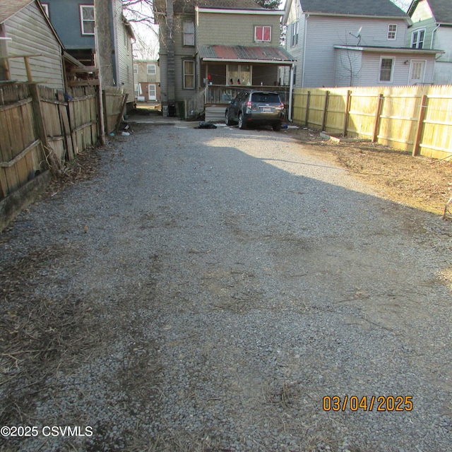 view of street featuring gravel driveway