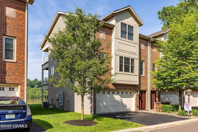 118 Jacobs Landing Way, Danville, PA 17821 - view of property featuring a garage, driveway, brick siding, and a front lawn