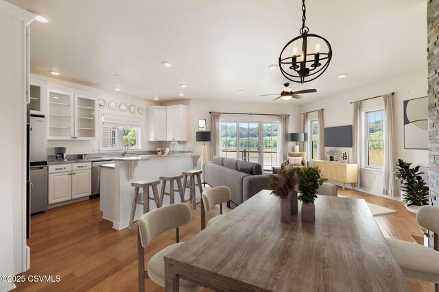 118 Jacobs Landing Way, Danville, PA 17821 - dining room featuring a chandelier, recessed lighting, light wood-style flooring, plenty of natural light, and a ceiling fan