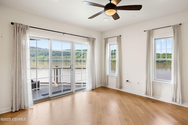 118 Jacobs Landing Way, Danville, PA 17821 - unfurnished room with wood finished floors, ceiling fan, and a water view