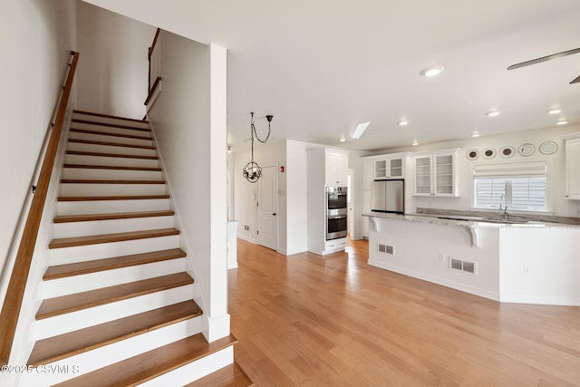 118 Jacobs Landing Way, Danville, PA 17821 - stairs featuring wood finished floors, recessed lighting, and ceiling fan