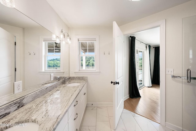118 Jacobs Landing Way, Danville, PA 17821 - bathroom featuring double vanity, healthy amount of natural light, and marble look tile flooring