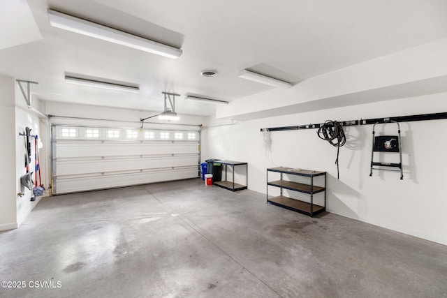 118 Jacobs Landing Way, Danville, PA 17821 - garage featuring a garage door opener and baseboards