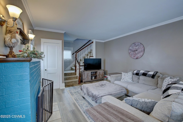 living area with ornamental molding, stairway, and light wood finished floors