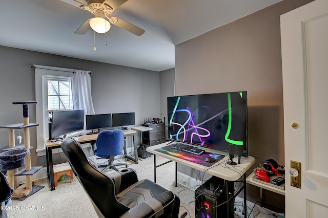 home office featuring a ceiling fan and light colored carpet