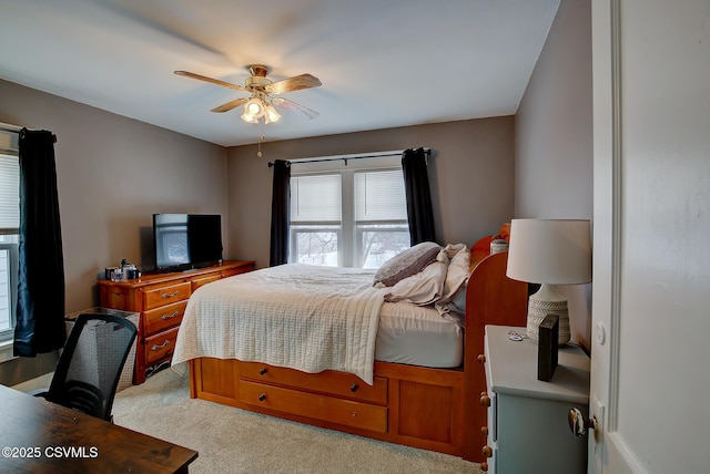 bedroom with light colored carpet and ceiling fan