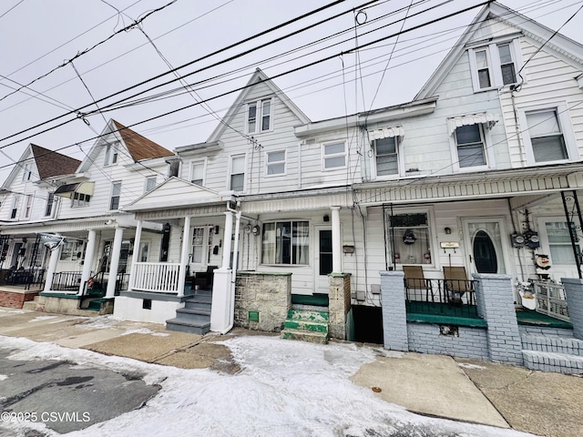 townhome / multi-family property with covered porch