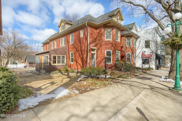 view of front of house featuring brick siding