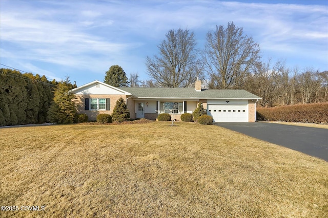 single story home with a front lawn and a garage