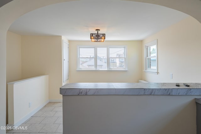 1041 Pine St, Kulpmont, PA 17834 - dining space with arched walkways and light tile patterned flooring