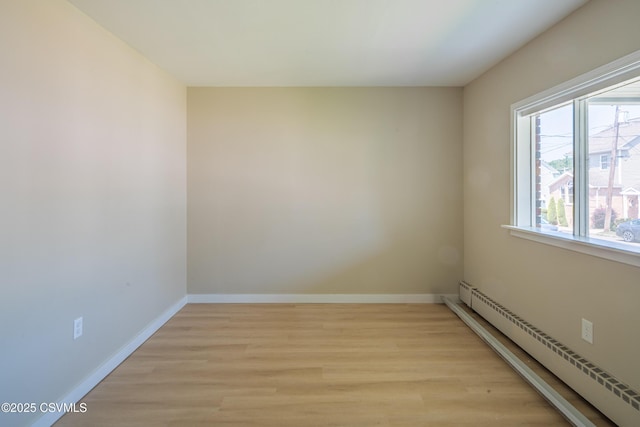 1041 Pine St, Kulpmont, PA 17834 - unfurnished room with a baseboard heating unit and light wood-style flooring