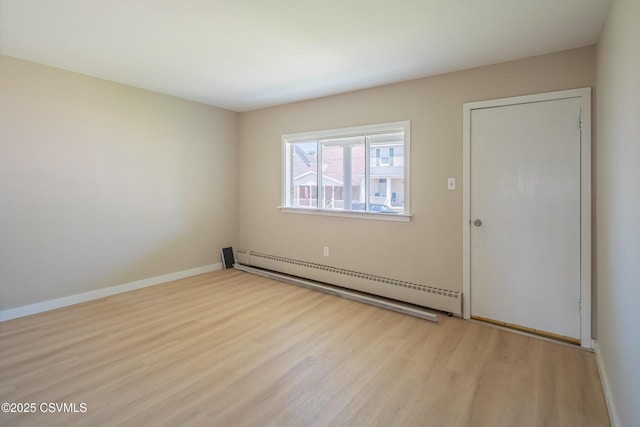 1041 Pine St, Kulpmont, PA 17834 - empty room with baseboard heating and wood finished floors