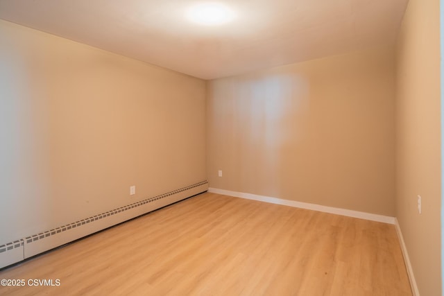 1041 Pine St, Kulpmont, PA 17834 - spare room featuring baseboard heating and wood finished floors