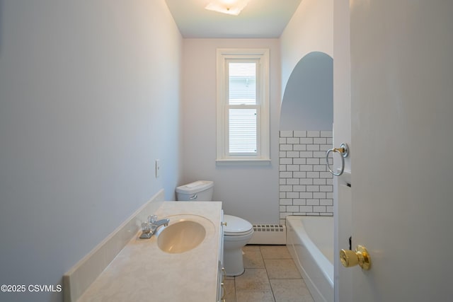 1041 Pine St, Kulpmont, PA 17834 - full bath featuring a tub to relax in, baseboard heating, vanity, tile patterned floors, and a shower