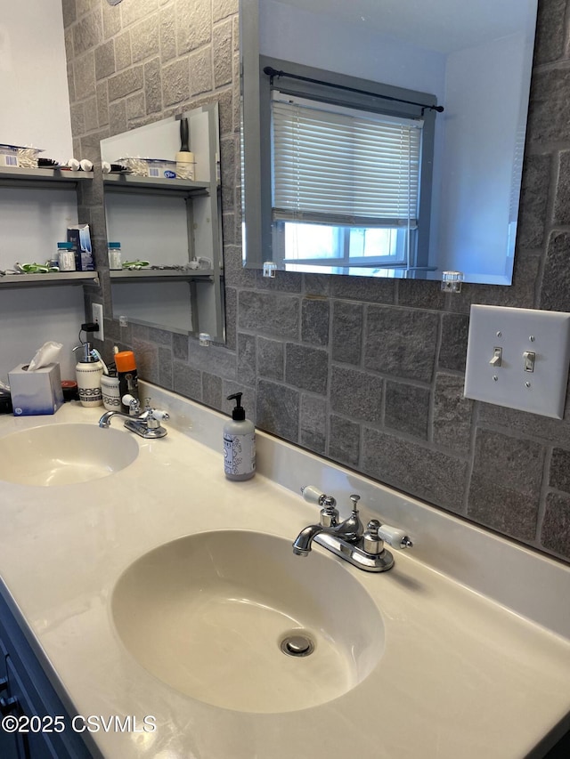 full bathroom featuring a sink and double vanity