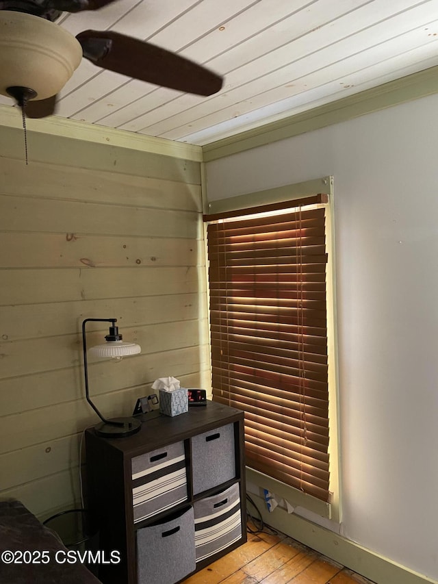 interior space featuring wood walls, wood ceiling, and hardwood / wood-style floors