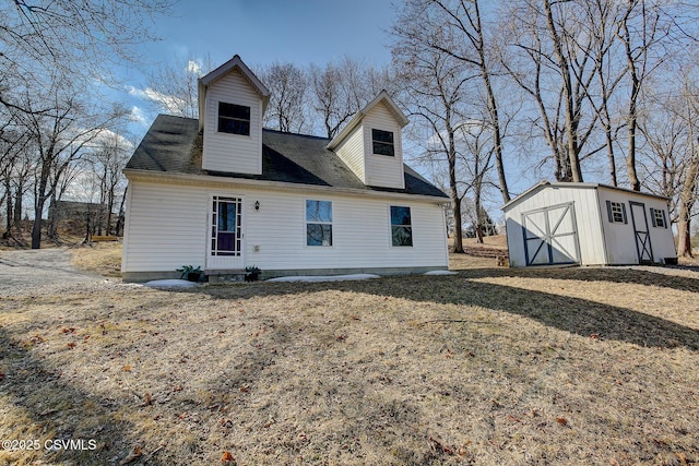 back of property with an outbuilding and a storage unit