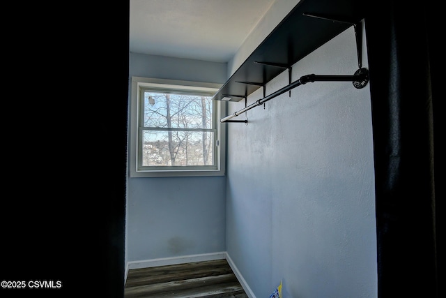 stairway with baseboards and wood finished floors