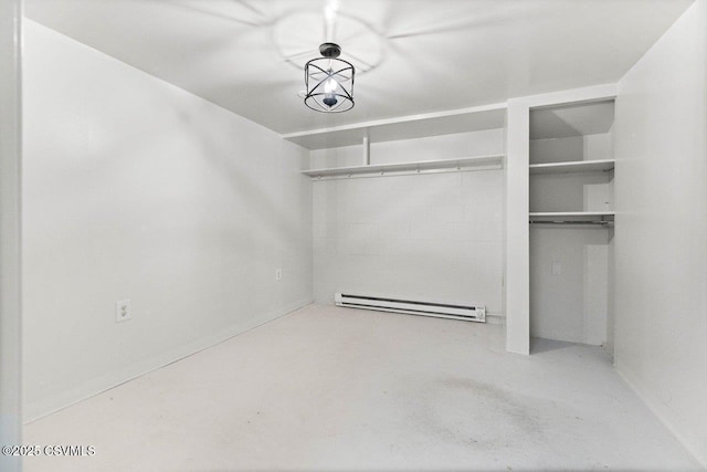 spacious closet featuring baseboard heating